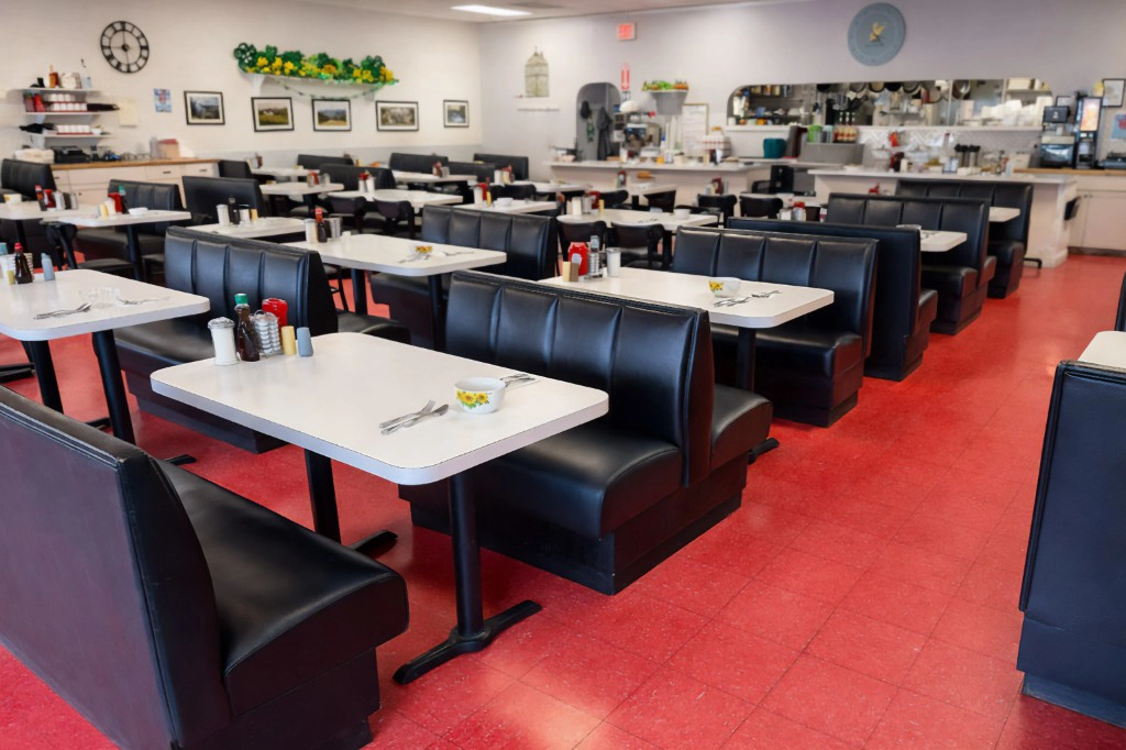 Inside the Early Bird Cafe dining room with classic diner booths in Plaistow NH
